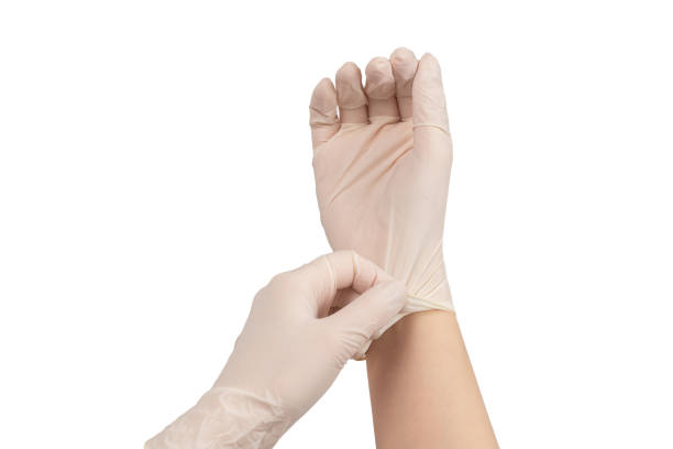 istock Woman puts on white rubber gloves. 1224435693