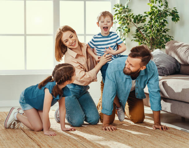 istock Happy family having fun at home 1224435775
