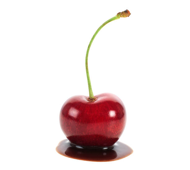 istock Red cherry in chocolate dipped isolated on a white background 1224439188
