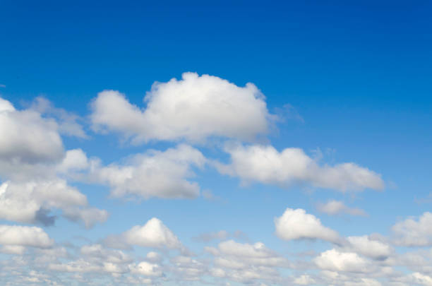 istock Blue summer sky white cumulus clouds background 1224441377