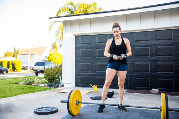 istock Woman using her smartphone to track her workout 1224443367