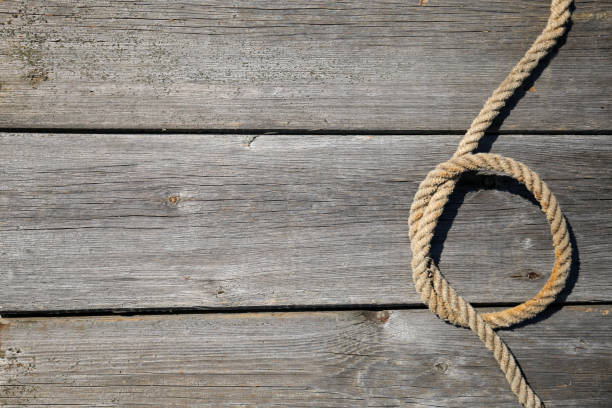 istock Ship rope on old wooden texture background with copy space 1224445008