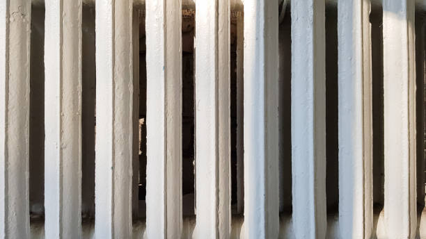 istock Old white cast-iron heating radiator in grunge style close-up 1224446645
