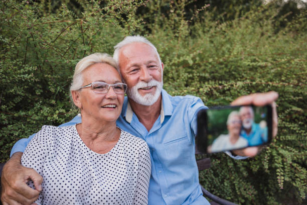 istock Happy old couple taking selfie 1224447100