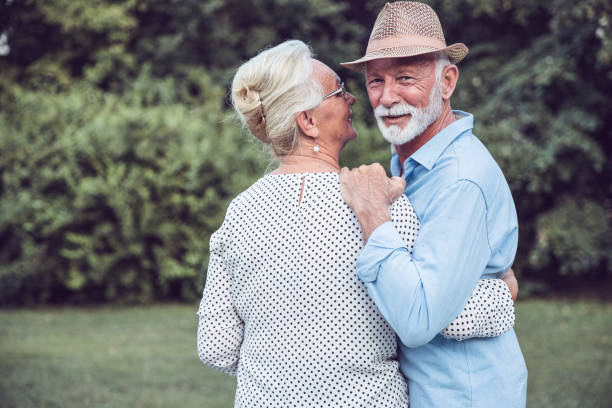 istock Satisfied man walking through the park with his wife 1224447193
