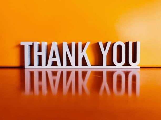 istock Thank you phrase on orange background 1224447668