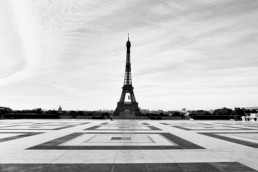 Eiffel Tower and Trocadero empty during pandemic Covid 19 in Europe. Usually crowded, there are no people, no tourists because people must stay at home and be confine. Schools, restaurants, stores, museums... are closed. Black and white picture. Paris, in France. April 30th , 2020.