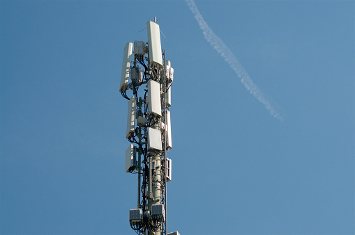 Telecommunication tower antenna of 4G and 5G mobile communication system located in Taverne, Switzerland
