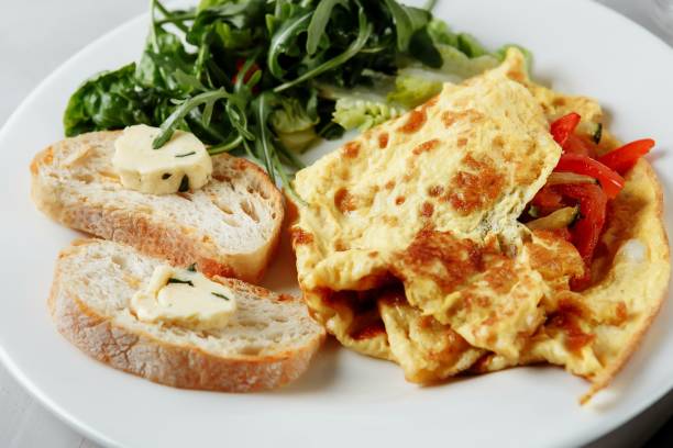 istock omelet with pepper and baguette, toast on a plate 1224449333