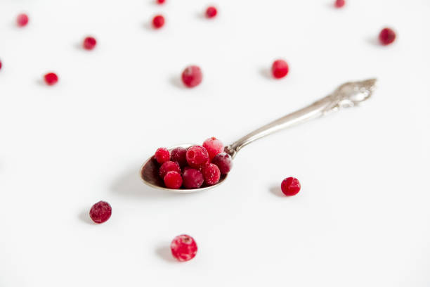 istock Frozen cranberries in the spoon.Fresh red berry cranberries.White background 1224450247