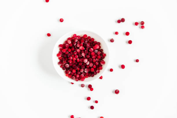 istock Frozen cranberries in the white plate.Fresh red berry cranberries.White background.Top view. 1224450422