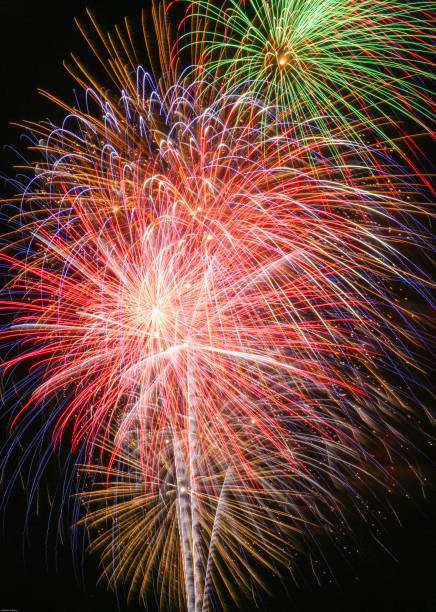 Shooting Fireworks in the Night Celebrating the 4th of July with bright fountains of aerial fireworks firework explosive material photos stock pictures, royalty-free photos & images