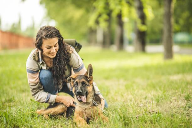 istock Woman with dog at park 1224452549
