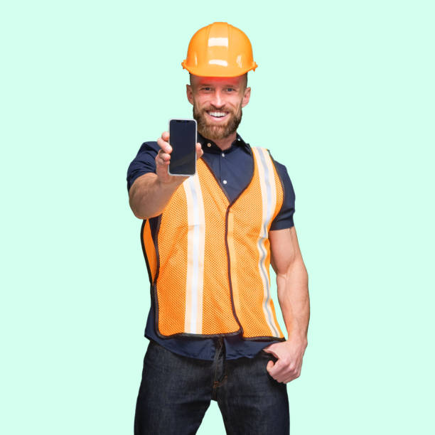 istock Caucasian young male standing and using mobile phone 1224454035