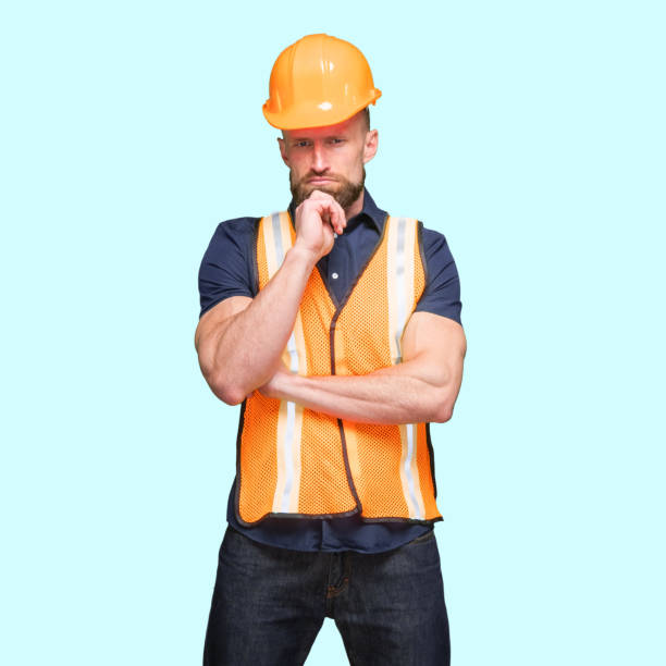 istock Caucasian young male standing in front of blue background 1224454502