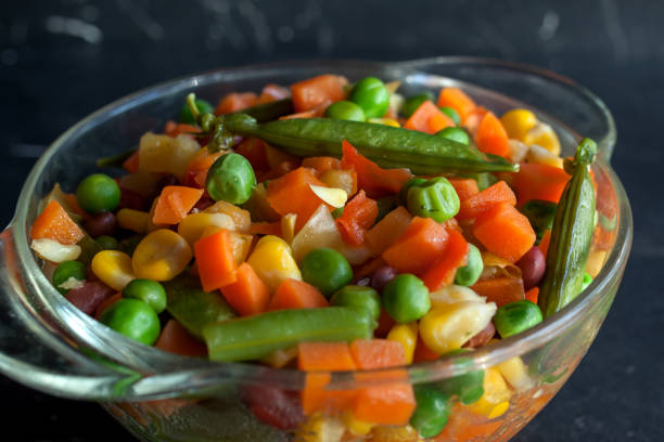 istock steamed vegetables on plate at dark background 1224454533