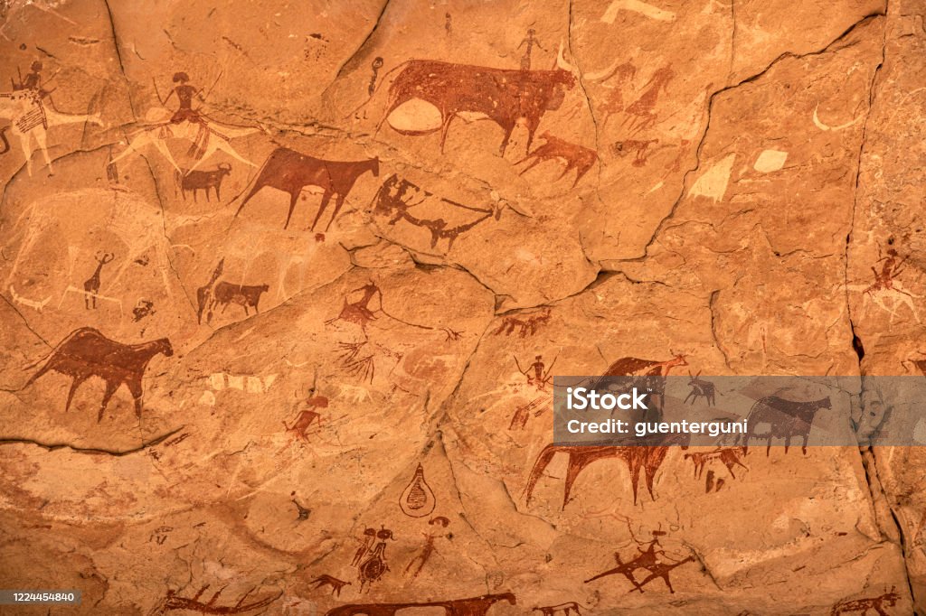 Prehistoric rock painting art, Ennedi massif, Sahara, Chad Prehistoric rock painting art in a cave in the remote Ennedi Mountains in the Sahara desert, North-East Chad. This famous rock art images can be dated to around 5000 BC onwards. The Ennedi massif was declared as an UNESCO World Heritage site in 2016. Prehistoric Art Stock Photo