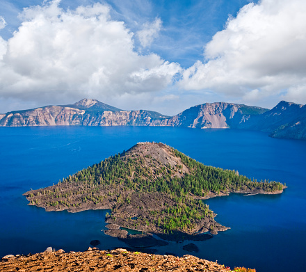 Crater Lake exists in the blown-out caldera of a once mighty volcano known as Mount Mazama. This view of the lake and Wizard Island was photographed from Watchman Overlook in Crater Lake National Park, Oregon, USA.