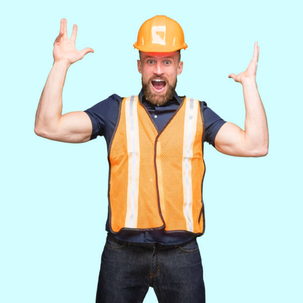 istock Caucasian young male standing in front of blue background 1224454977