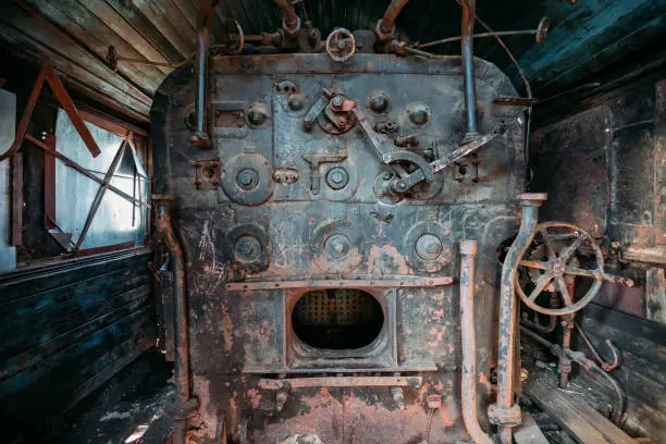 Photo of Old steam engine of abandoned steam locomotive Inside driving cabin