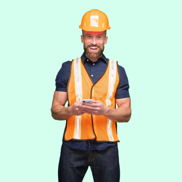 istock Caucasian male standing and using smart phone 1224457003