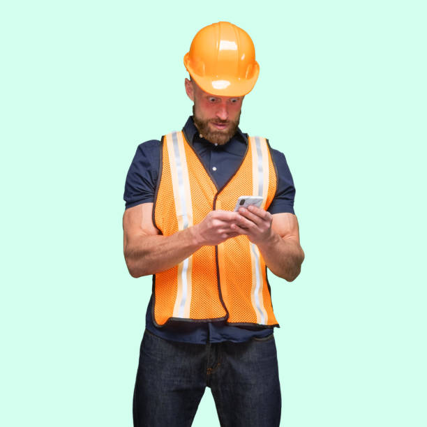istock Caucasian male standing and using smart phone 1224457809