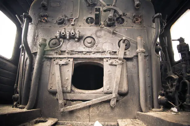 Photo of Old steam engine of abandoned steam locomotive Inside driving cabin