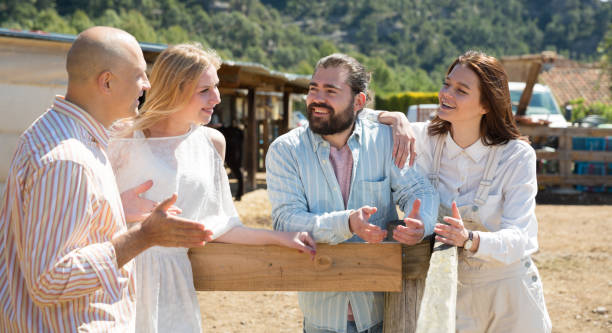 istock Happy friends chatting on rustic farm background 1224462748