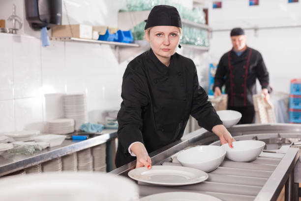 istock Woman arranging clean dishware 1224462750