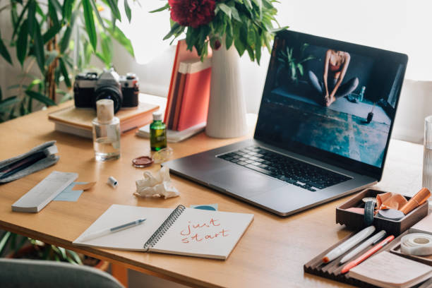 istock Open Laptop on a Woman's Messy Desk at Home 1224465626