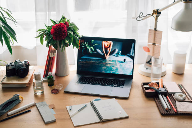 istock Open Laptop on a Woman's Messy Desk at Home 1224465627