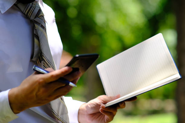 istock Businessman using a mobile phone outdoor 1224467284