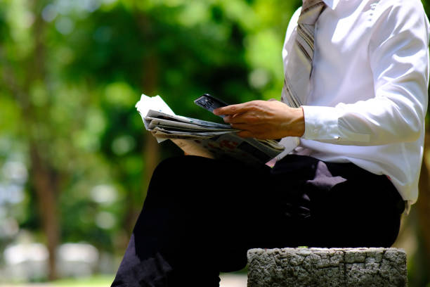 istock Businessman using a mobile phone outdoor 1224468051