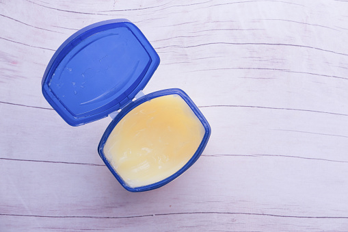 white petroleum jelly in a container, Top view .