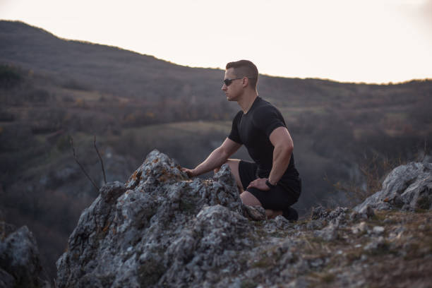 istock Strong man on top of the mountain 1224476125