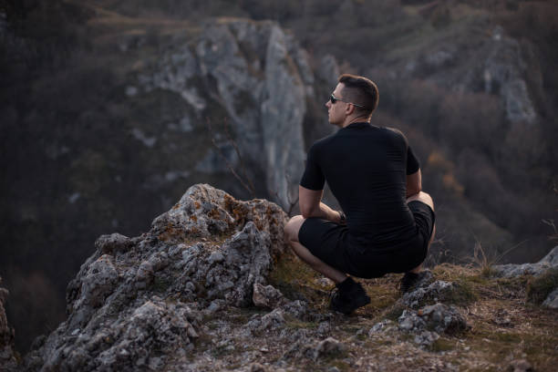 istock Strong man after a hard exercise on the mountain top 1224477392