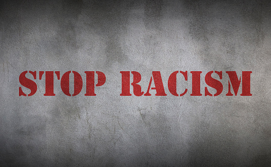 Stop Racism concept on wall background