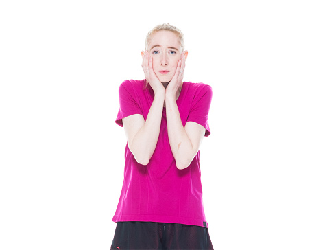Waist up of aged 20-29 years old who is beautiful caucasian female standing in front of white background wearing sports clothing who is tired