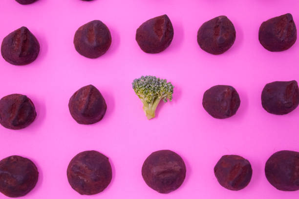 istock Vibrant broccoli stands out amongst rows of chocolate 1224480653