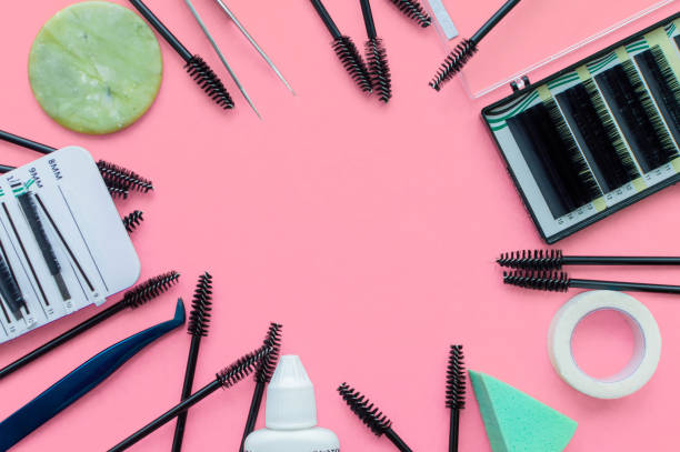 istock Template. Tools for eyelash extension on a pink background with a place for writing. 1224482509