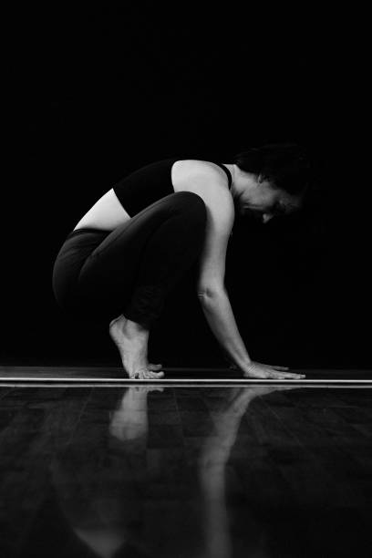 istock Yoga on black background 1224482624