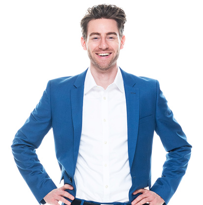 Portrait of aged 30-39 years old with brown hair caucasian male business person standing in front of white background wearing jacket who is successful with hand on hip