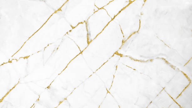 istock White and gold marble luxury wall texture with shine golden line pattern abstract background design for a cover book or wallpaper and banner website. 1224484797