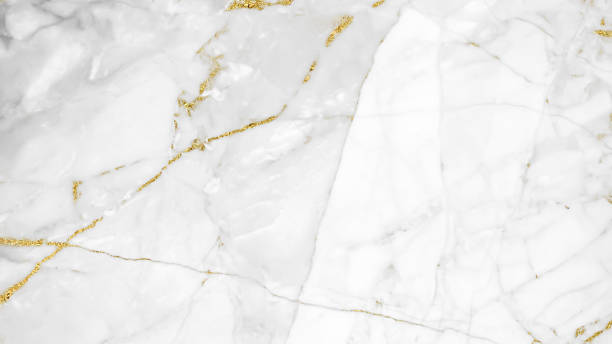istock White and gold marble luxury wall texture with shine golden line pattern abstract background design for a cover book or wallpaper and banner website. 1224485339