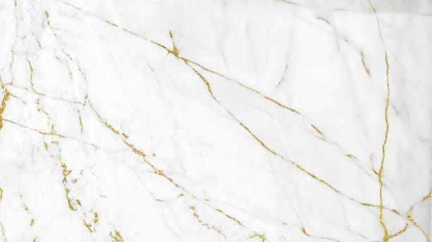 istock White and gold marble luxury wall texture with shine golden line pattern abstract background design for a cover book or wallpaper and banner website. 1224485345