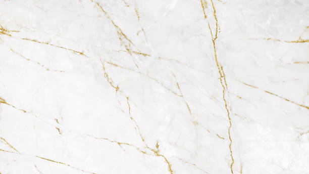 istock White and gold marble luxury wall texture with shine golden line pattern abstract background design for a cover book or wallpaper and banner website. 1224485366