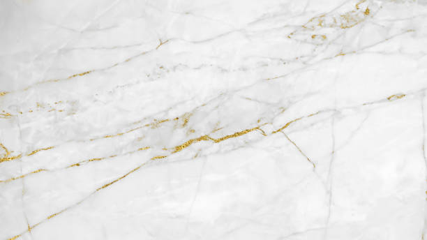istock White and gold marble luxury wall texture with shine golden line pattern abstract background design for a cover book or wallpaper and banner website. 1224485390