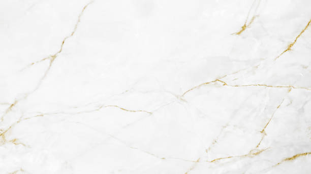 istock White and gold marble luxury wall texture with shine golden line pattern abstract background design for a cover book or wallpaper and banner website. 1224485595