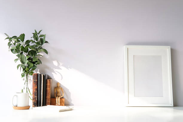 istock Mockup workspace desk and copy space books,plant and coffee on white desk. 1224487381