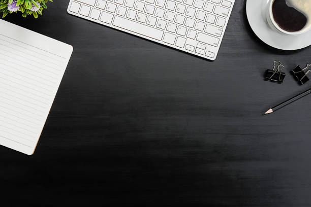 istock Top view office stuff with notepad, laptop and coffee cup mouse notepad shot.blank screen mobile phone and supplies on white desk workspace and copy space. 1224487383